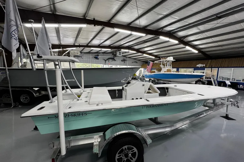Slide: The Image of Interior view of a 2026 Mitzi Skiffs 17 Tournament boat in a showroom. - 8