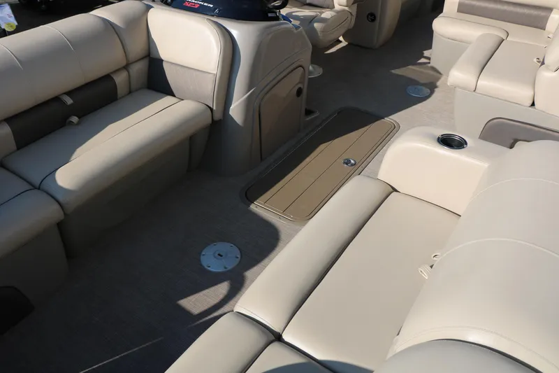 Slide: The Image of 2022 Sun Tracker Party Barge 22 RF XP3 interior with beige seating and cup holders. - 15
