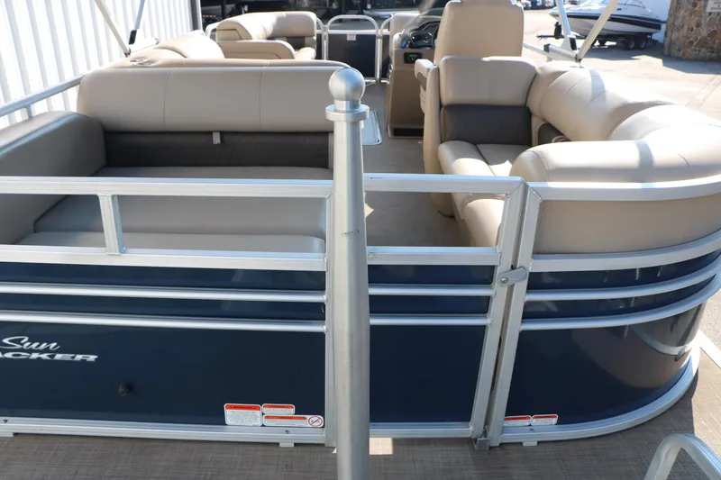 Slide: The Image of 2022 Sun Tracker Party Barge 22 RF XP3 pontoon boat with beige seating and blue exterior. - 17