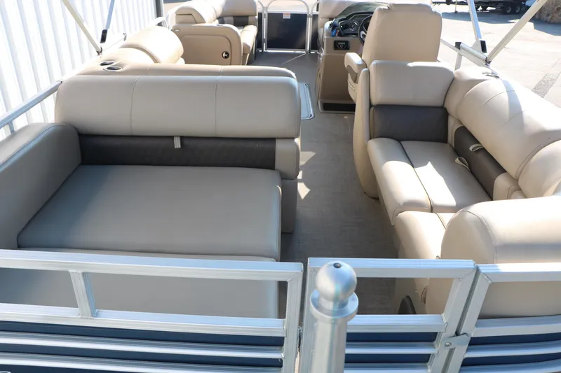 Slide: The Image of 2022 Sun Tracker Party Barge 22 RF XP3 interior with beige seating and spacious layout. - 18
