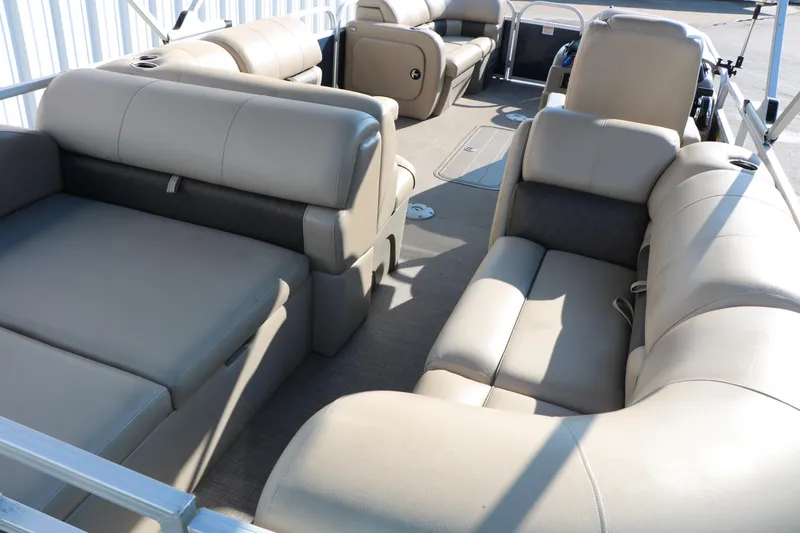 Slide: The Image of 2022 Sun Tracker Party Barge 22 RF XP3 interior with beige seating and spacious layout. - 19