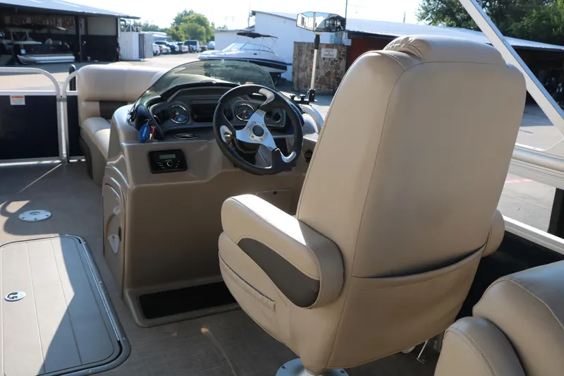 Slide: The Image of 2022 Sun Tracker Party Barge 22 RF XP3 interior with steering console and seating. - 21