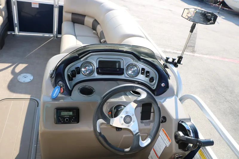 Slide: The Image of 2022 Sun Tracker Party Barge 22 RF XP3 helm with steering wheel and controls. - 26