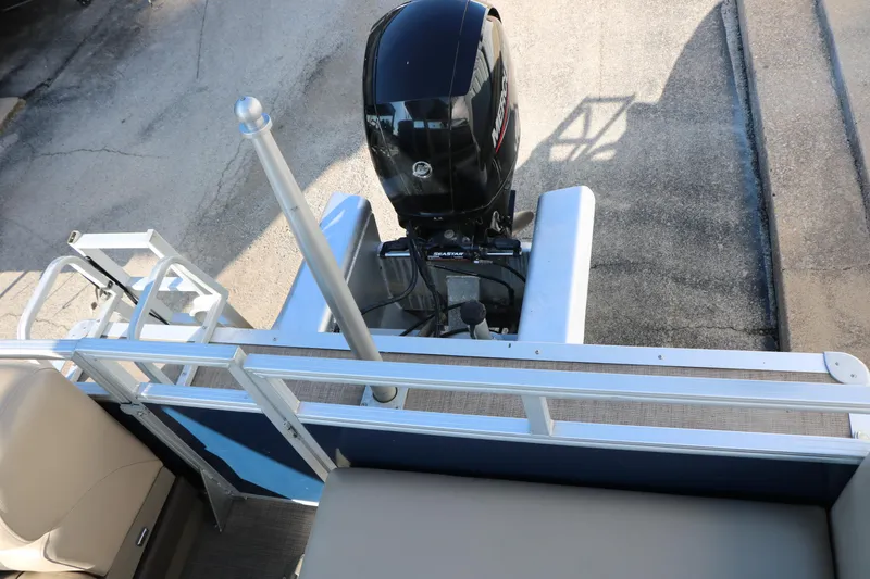 Slide: The Image of 2022 Sun Tracker Party Barge 22 RF XP3 with outboard motor, rear view. - 28