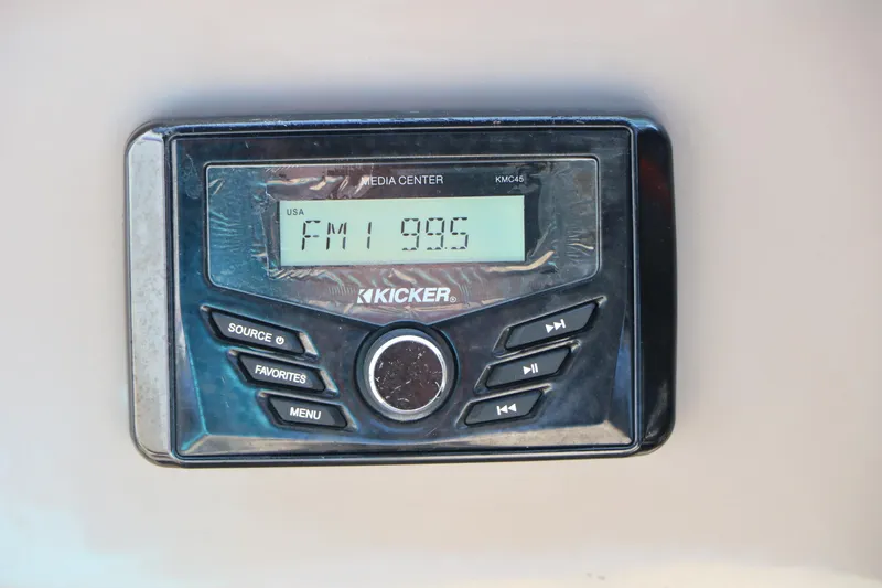 Slide: The Image of Kicker media center displaying FM 99.5 on Sun Tracker Party Barge 22 RF XP3, 2022 model. - 30