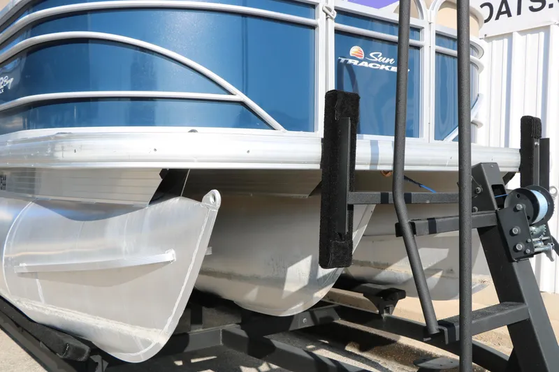Slide: The Image of 2022 Sun Tracker Party Barge 22 RF XP3 pontoon boat on trailer, close-up view. - 6