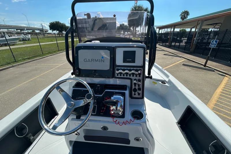 Slide: The Image of 2018 Blue Wave 2300 PureBay boat dashboard with Garmin navigation system and steering wheel. - 11
