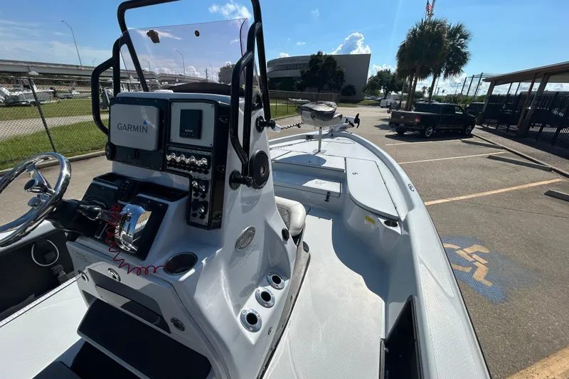 Slide: The Image of 2018 Blue Wave 2300 PureBay boat with Garmin navigation, parked in a sunny lot. - 14