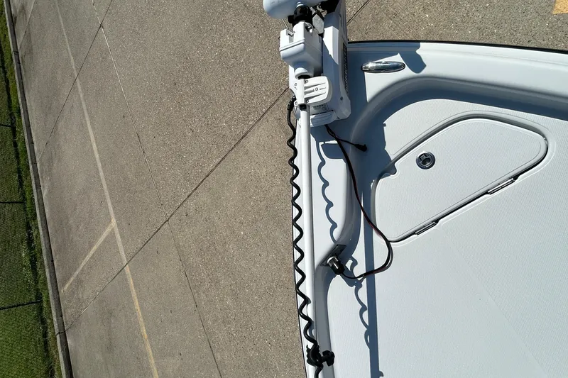 Slide: The Image of 2018 Blue Wave 2300 PureBay boat deck with trolling motor and storage hatch. - 17