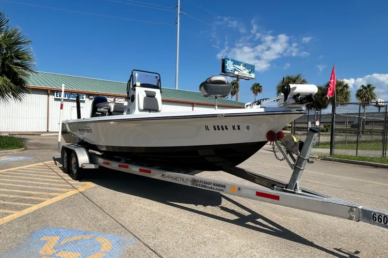Slide: The Image of 2018 Blue Wave 2300 PureBay boat on trailer in sunny parking lot. - 5