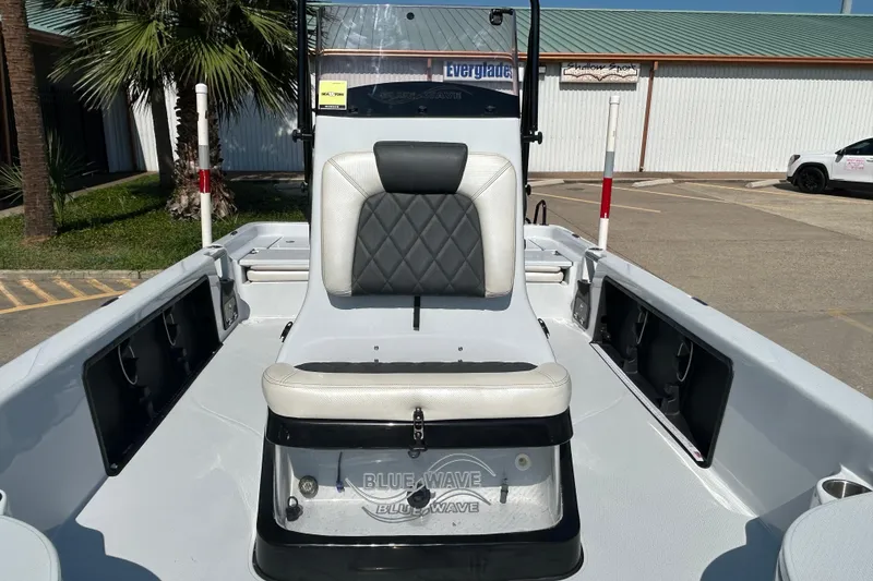 Slide: The Image of 2018 Blue Wave 2300 PureBay boat interior with seating and storage compartments. - 8