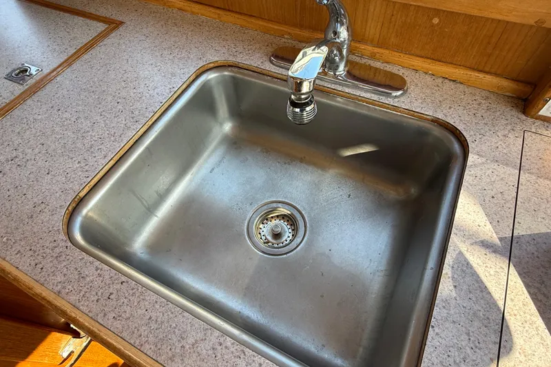 Slide: The Image of Stainless steel sink in 1988 Grand Banks Heritage CL yacht kitchen. - 18