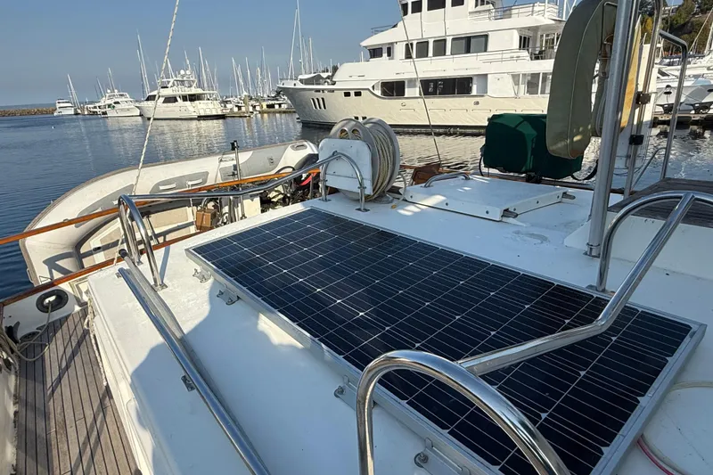 Slide: The Image of 1988 Grand Banks Heritage CL yacht with solar panel, docked at marina. - 39