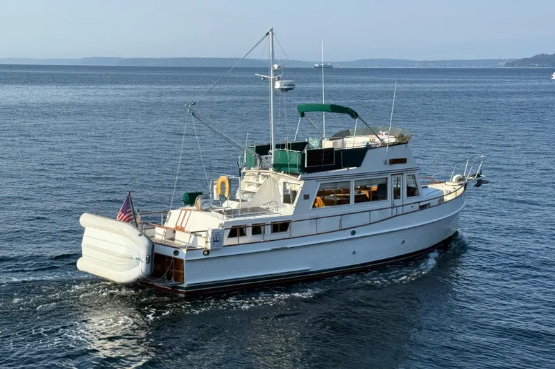 Slide: The Image of 1988 Grand Banks Heritage CL yacht cruising on open water. - 5
