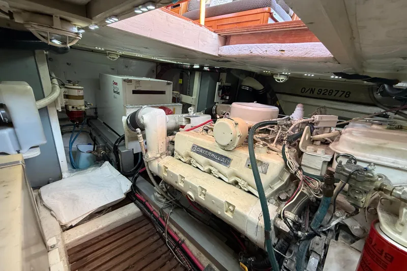 Slide: The Image of Engine room of 1988 Grand Banks Heritage CL with Caterpillar engine and Onan generator. - 51
