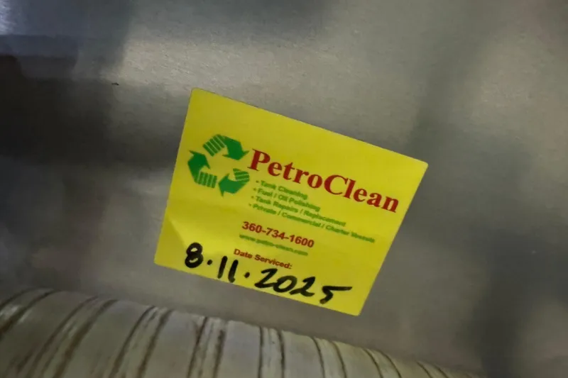 Slide: The Image of Yellow PetroClean service sticker on Grand Banks Heritage CL, dated 8/11/2025. - 54