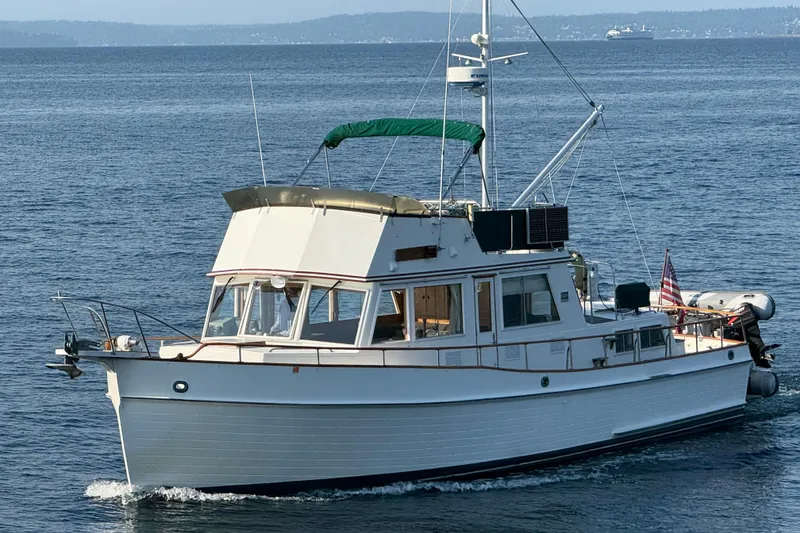 Slide: The Image of 1988 Grand Banks Heritage CL yacht cruising on open water. - 56