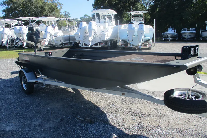 Slide: The Image of 2026 Gator Tail 1748 Gator Series boat on trailer, parked in a marina lot. - 4