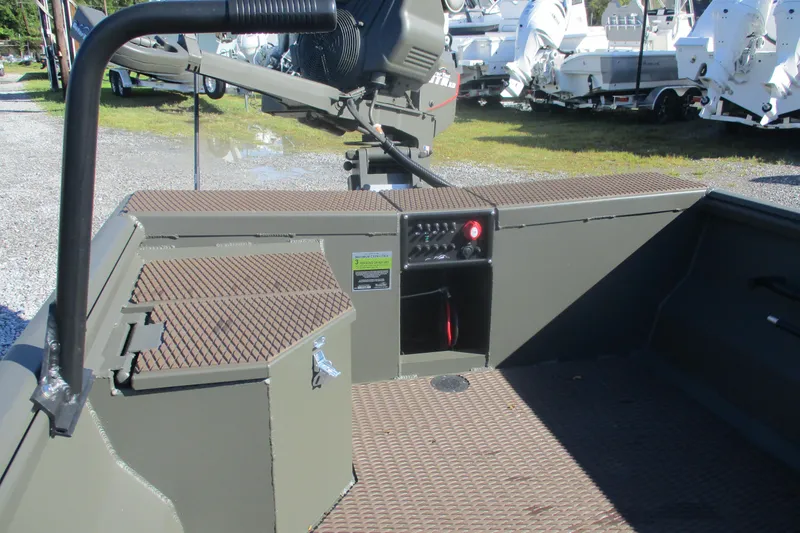 Slide: The Image of 2026 Gator Tail 1748 Gator Series boat interior with control panel and storage compartments. - 6