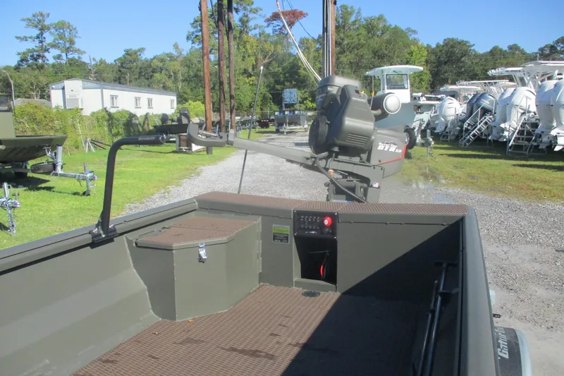 Slide: The Image of 2026 Gator Tail 1748 Gator Series boat in outdoor showroom, surrounded by greenery and other boats. - 9