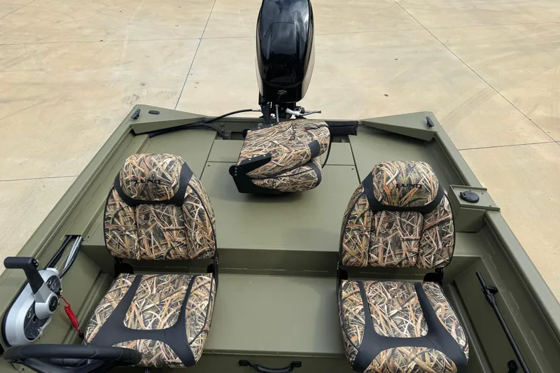 Slide: The Image of 2026 Lund 1760 Predator SC boat on trailer at Boateka dealership. - 3