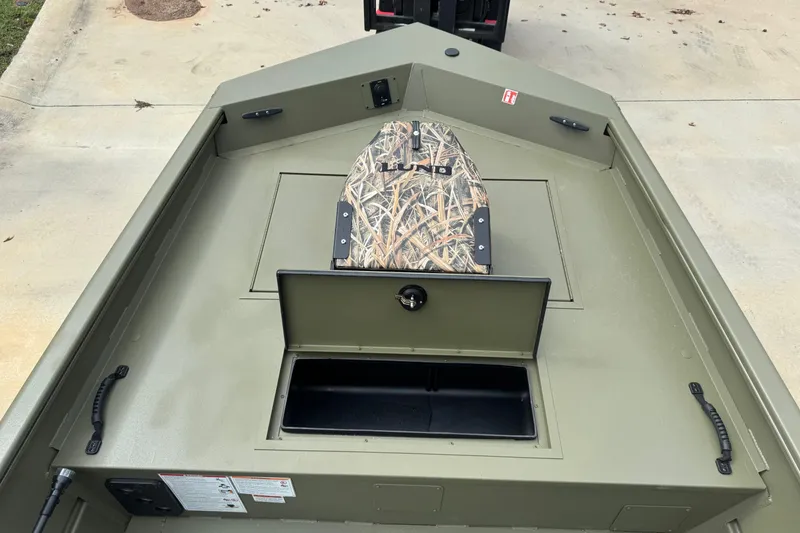 Slide: The Image of 2026 Lund 1760 Predator SC boat interior with steering wheel and control panel. - 6