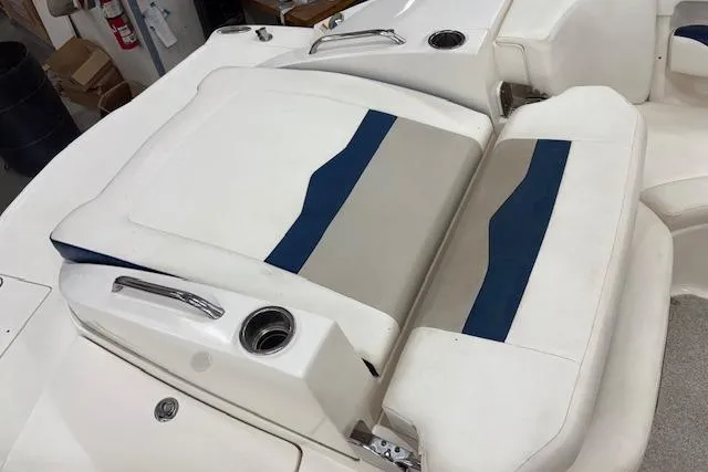 Slide: The Image of 2011 Chaparral 226 SSi boat interior with white and blue seating. - 11