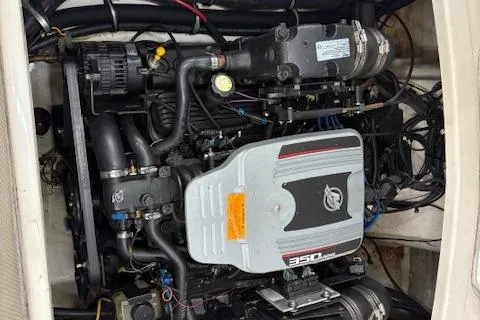 Slide: The Image of 2011 Chaparral 226 SSi engine compartment showcasing a 350 MAG engine. - 13