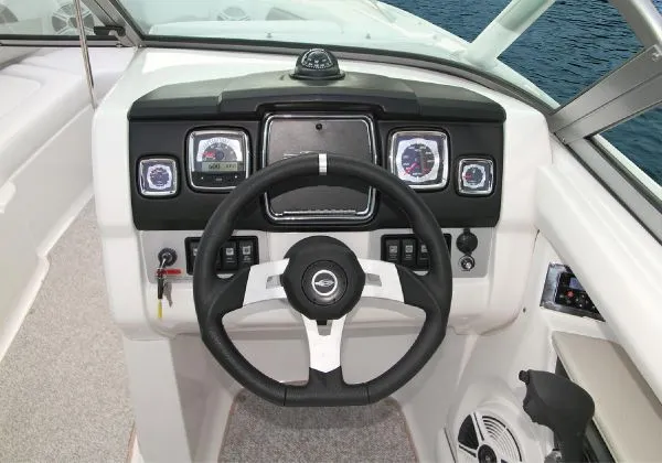 Slide: The Image of Manufacturer Provided Image: 2011 Chaparral 226 SSi boat dashboard with steering wheel and instrument panel. - 18