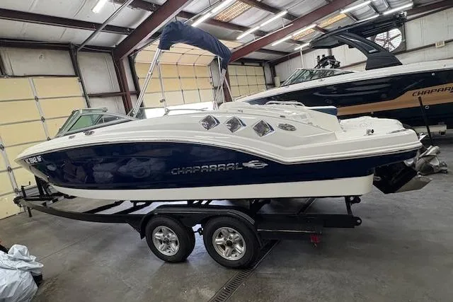 Slide: The Image of 2011 Chaparral 226 SSi boat on trailer in indoor storage facility. - 2