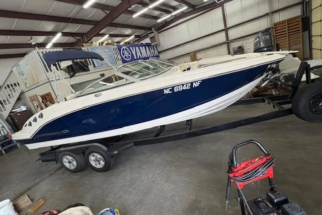 Slide: The Image of 2011 Chaparral 226 SSi boat on trailer in a garage setting. - 3