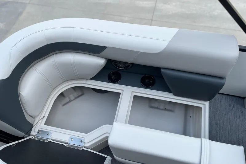 Slide: The Image of 2026 Godfrey Sweetwater 2086 SB boat interior with storage compartment and cushioned seating. - 16