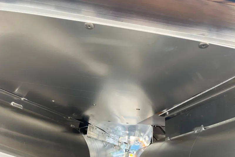 Slide: The Image of Interior view of 2026 Godfrey Sweetwater 2086 SB boat hull, showcasing sleek metal design. - 22