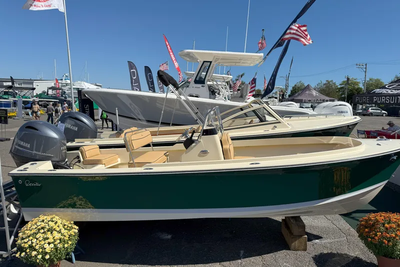 Slide: The Image of 2026 Rossiter 17 CC boat displayed at outdoor boat show with Yamaha engines. - 3