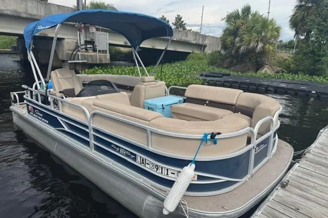 Slide: The Image of 2019 Sun Tracker Party Barge 20 DLX pontoon boat docked by a bridge. - 13
