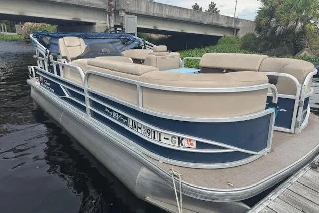 Slide: The Image of 2019 Sun Tracker Party Barge 20 DLX pontoon boat docked by a bridge. - 5