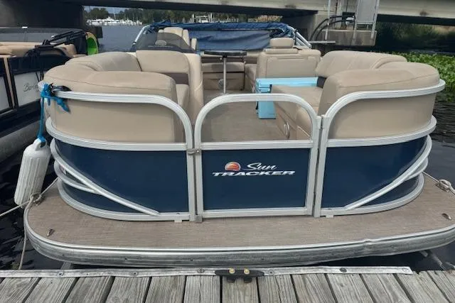 Slide: The Image of 2019 Sun Tracker Party Barge 20 DLX pontoon boat docked by the water. - 6