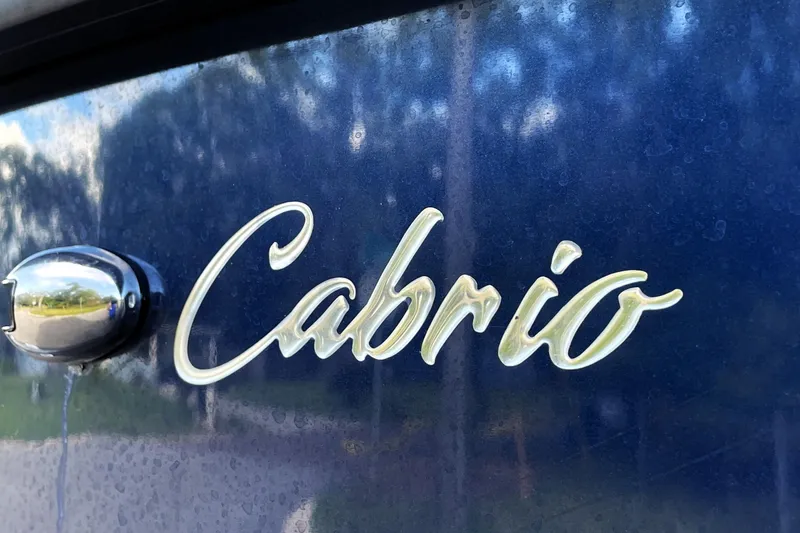 Slide: The Image of 2022 Barletta Cabrio 22QC logo on a blue surface, close-up view. - 21