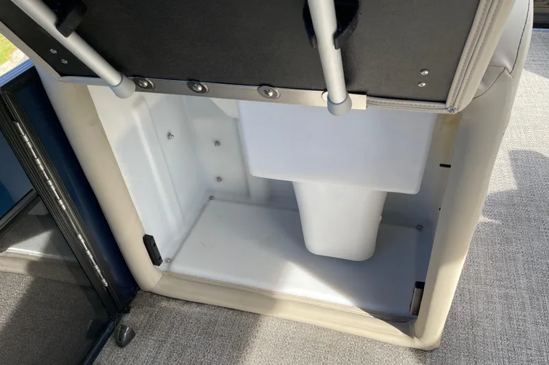 Slide: The Image of 2022 Barletta Cabrio 22QC storage compartment with open lid, showcasing interior space. - 32