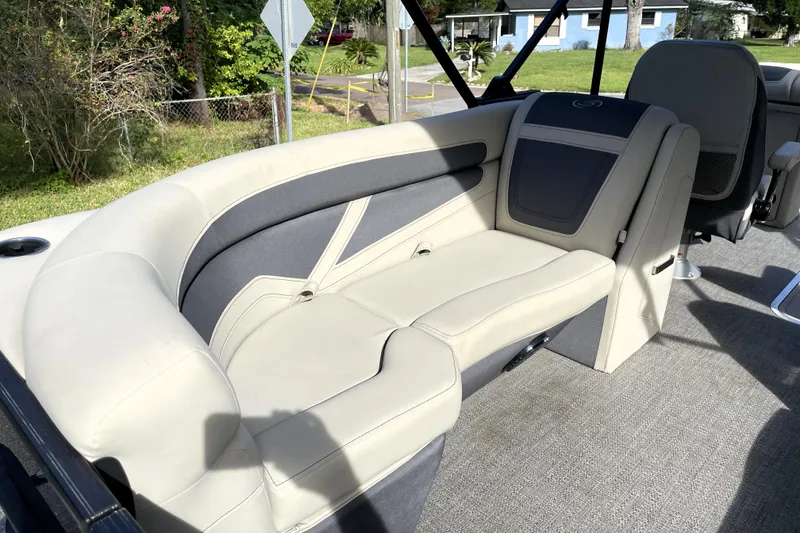 Slide: The Image of 2022 Barletta Cabrio 22QC boat interior with plush seating and modern design. - 36