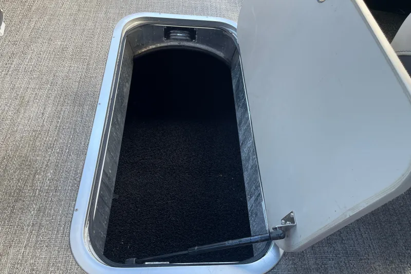 Slide: The Image of Open storage compartment in 2022 Barletta Cabrio 22QC boat. - 40