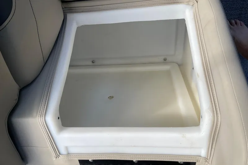 Slide: The Image of Open storage compartment in 2022 Barletta Cabrio 22QC boat seat. - 42