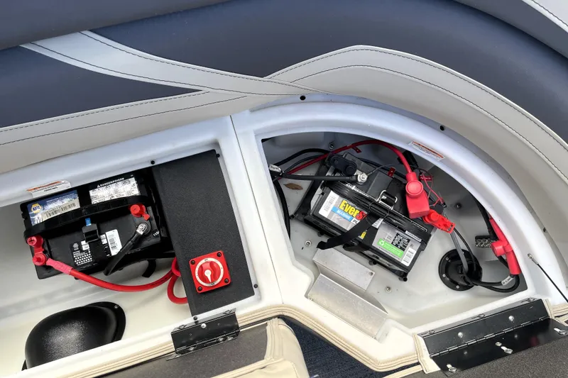 Slide: The Image of Battery compartment of 2022 Barletta Cabrio 22QC pontoon boat, featuring dual batteries. - 48