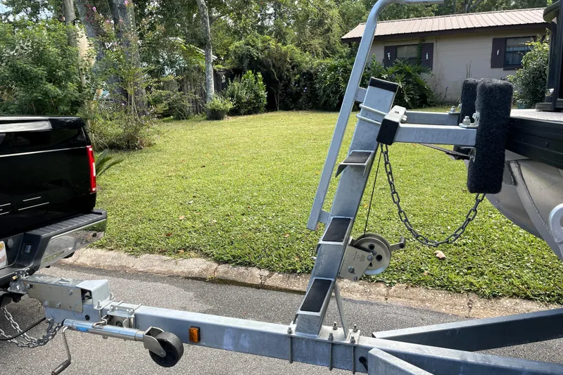 Slide: The Image of Trailer hitch connected to a vehicle, Barletta Cabrio 22QC, 2022 model, parked on a street. - 51