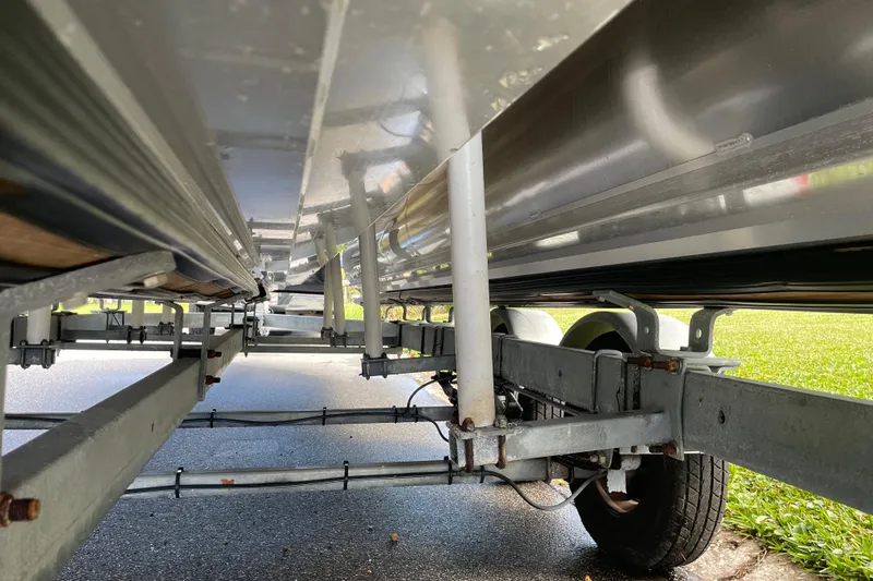 Slide: The Image of Underneath view of a 2022 Barletta Cabrio 22QC boat trailer, showcasing its structure. - 53