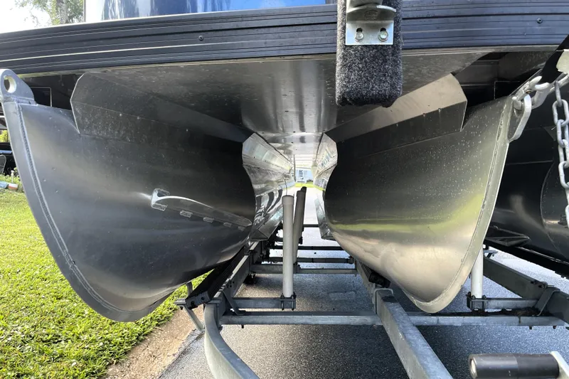 Slide: The Image of Underneath view of 2022 Barletta Cabrio 22QC pontoon boat on a trailer. - 8