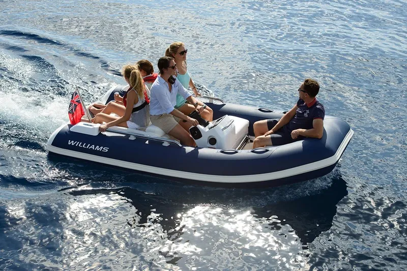 Slide: The Image of 2021 Williams Jet Tenders Sportjet 345 with passengers cruising on open water. - 12