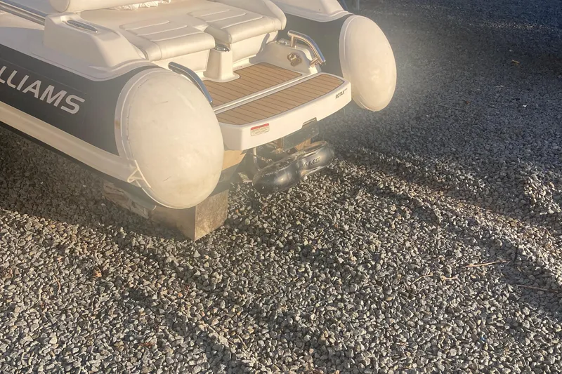 Slide: The Image of 2021 Williams Jet Tenders Sportjet 345 on gravel surface, rear view. - 4