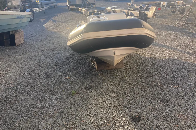 Slide: The Image of 2021 Williams Jet Tenders Sportjet 345 on gravel lot, front view. - 5