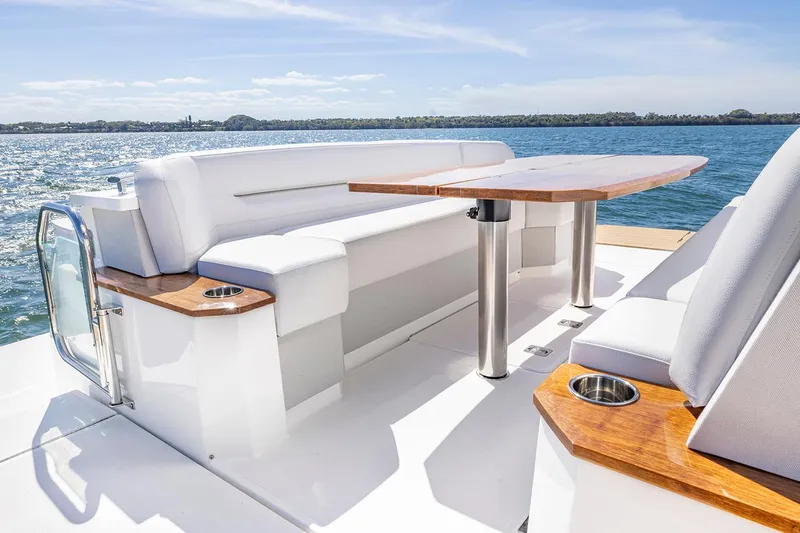 Slide: The Image of Manufacturer Provided Image: 2025 Tiara Yachts EX 54 deck with elegant seating and ocean view. - 9